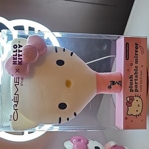 The creme hello kitty plush portable mirror